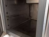 a silver microwave oven with a door open on a white background