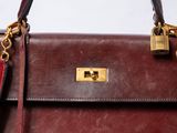 a close up of a purse with a lock on it