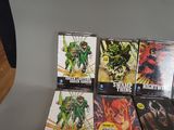 a lot of comic books sitting on a table