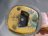 a person holding a metal object in their hand