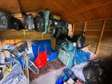 a room with a lot of bags and bags on the floor