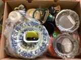 a box full of assorted dishes and cups