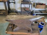an old anvil being worked on in a workshop