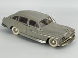 a toy car that is sitting on a white surface