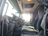 a view of the inside of a vehicle from the driver ' s seat