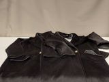 black jacket on a white table with a white background