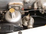 a close up of a car ' s engine with the hood open
