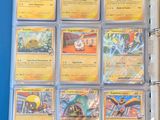 the inside of a binder with a lot of pokemon cards on it