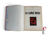 an open book with a picture of a red dragon on it