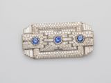 an art deco broochle with blue and white stones