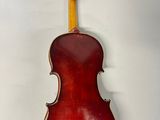 an old violin is hanging on a wall in a room
