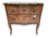 a marble top chest of drawers on a stand
