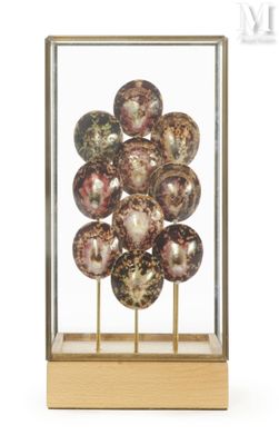 a glass display case with a bunch of glass balls in it