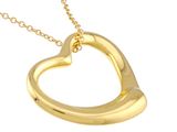 gold plated heart pendant on a gold chain on a white background