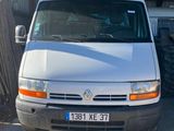 a white van that is parked in front of a building