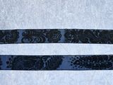 two black and white ribbons on a white surface