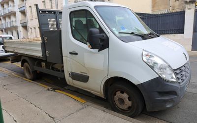 a white truck that is parked on the side of the street