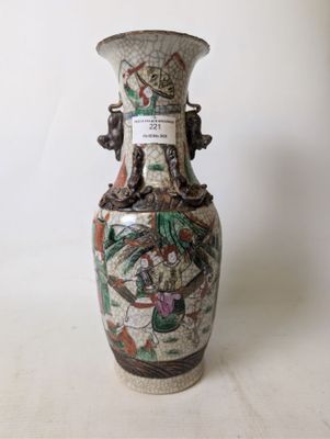a vase that has a picture of a dragon on it