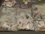 a lot of stamps and postcards on the table