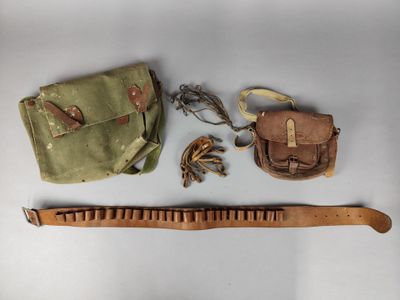 a wooden comb, a bag, and a pair of scissors on a table