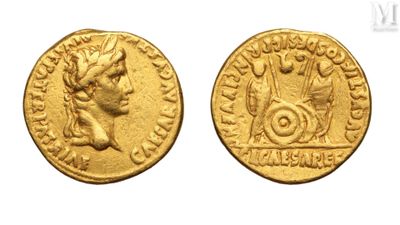 a gold coin with an image of a man and a woman on it