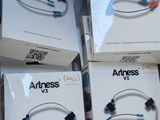 several boxes of earphones are stacked on top of each other