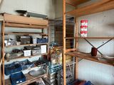 a room with a lot of items on the shelves