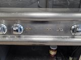 stainless steel stove top with three burners and three burners