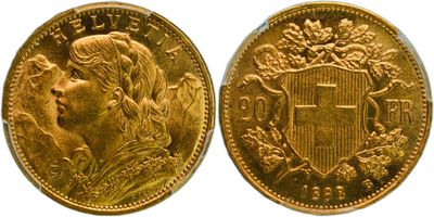 a close up of two gold coins on a white background