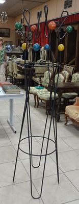 a man standing in a room with a lot of furniture