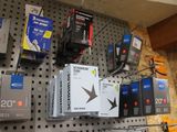 many electronic devices on the wall in the store
