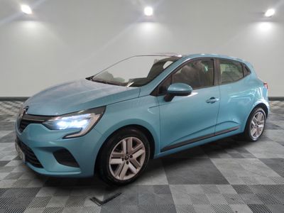 a blue car is parked in a room with a checkered floor
