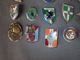 a lot of badges that are on a table