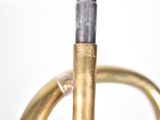 a close up view of a brass instrument with a bell