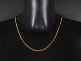 un collier à chaîne en or sur un mannequin mannequin mannequin mannequin mannequin mannequin mannequin mannequin mannequin mannequin