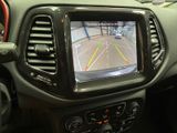 a view of a car ' s rear view mirror from inside the vehicle