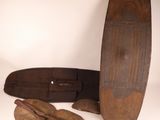 a skateboard and a pair of shoes on a white surface