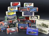 many different models of cars in boxes on a black surface