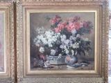 two paintings of flowers in a vase on a table