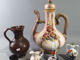 a group of vases that are sitting on a table