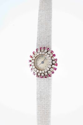 an image of a woman ' s wrist watch with pink and white stones