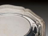 a silver plate that is sitting on a table
