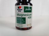 a bottle of magnesium on a white surface