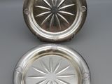 pair of silver plated ashtrays with starburst design
