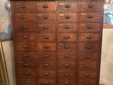 an old wooden chest of drawers in a room