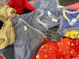 a suitcase filled with clothes and other items on the floor