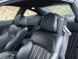 the interior of a car with black leather seats and black leather trims