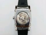 a close up of a watch on a white surface