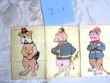 trois cartes représentant des personnages de dessins animés, posées sur une table
