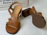 an image of a pair of sandals with a box in the background